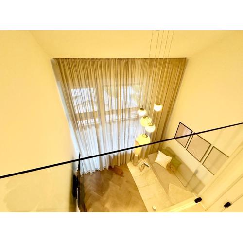 Das Alpenzeit Loft mit Balkon und Grimmingblick