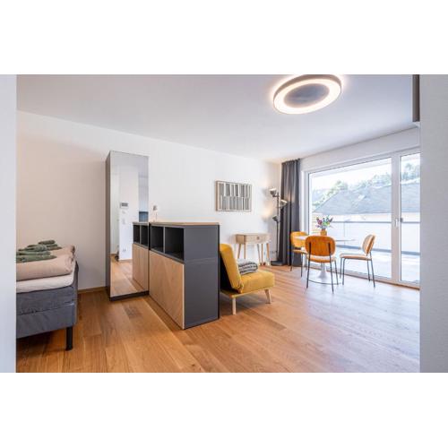 Modernes Studio mit sonniger Dachterrasse